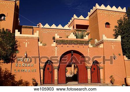 Front of Hotel Kasbah Lamrani berber architecture style of red adobe fortress Morocco View Large Photo Image Stock Image - Front of Hotel Kasbah Lamrani berber architecture style of red adobe fortress Morocco. Fotosearch