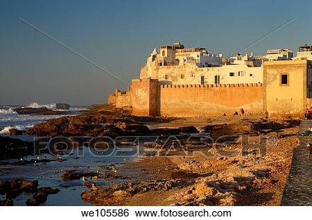 Golden glowing sea bastion ramparts of Essaouira Morocco at sunset View Large Photo Image Stock Photograph - Golden glowing sea bastion ramparts of Essaouira Morocco at sunset. Fotosearch