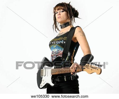 Heavy Metal chick with horns and tattoos holding a black guitar on a white background View Large Photo Image Stock Image - Heavy Metal chick with horns and tattoos holding a black guitar on a white background. Fotosearch