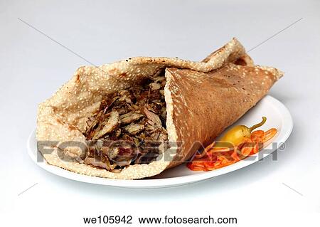 Lamb and turkey shawarma in a Lafa flat Iraqi pita View Large Photo Image Stock Image - Lamb and turkey shawarma in a Lafa flat Iraqi pita. Fotosearch
