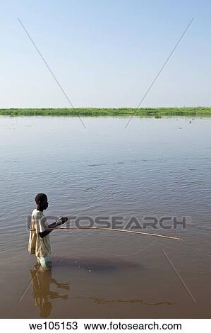 man fishing in Nile River, Bor Sudan, December 2010 View Large Photo Image Stock Image - man fishing in Nile River, Bor Sudan, December 2010. Fotosearch
