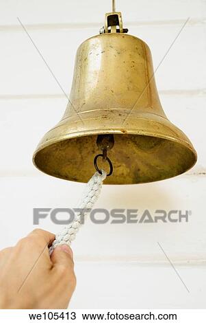 Man ringing a bell View Large Photo Image Stock Image - Man ringing a bell. Fotosearch
