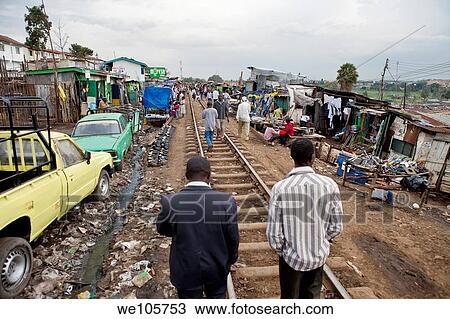 Stock Image - Market and railroad tracks in Kibera, Kenya. Fotosearch