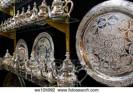 Metalware shop with silver teapots and plates with intricate design engraving Fes Morocco View Large Photo Image Stock Image - Metalware shop with silver teapots and plates with intricate design engraving Fes Morocco. Fotosearch