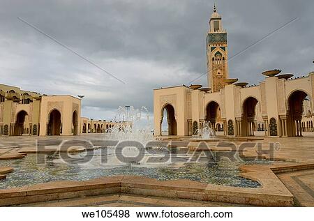 Minaret and fountains at the Hassan II Mosque in Casablanca Morocco on a stormy day View Large Photo Image Stock Photo - Minaret and fountains at the Hassan II Mosque in Casablanca Morocco on a stormy day. Fotosearch