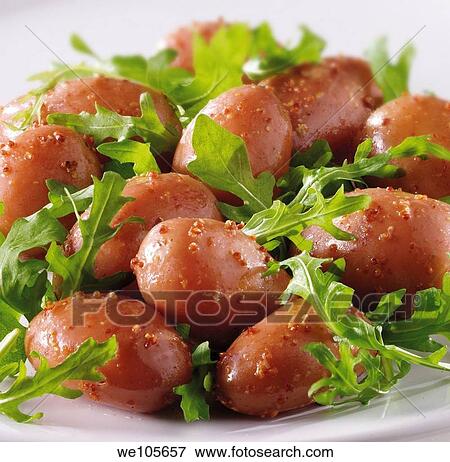 Stock Photo - New potatoes and rocket leaves salad with a mustard dressing food photos. Fotosearch
