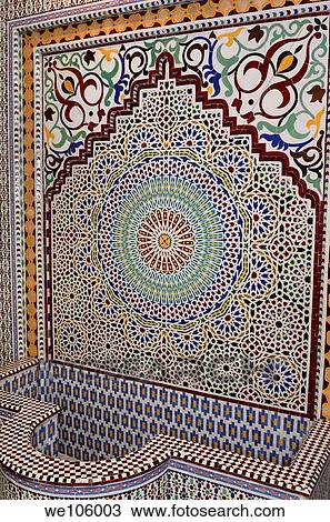 Newly completed Zellige terra cotta glazed tile water fountain mosaic pattern Fes Morocco shop View Large Photo Image Stock Image - Newly completed Zellige terra cotta glazed tile water fountain mosaic pattern Fes Morocco shop. Fotosearch