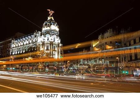 Stock Photo - Night viwe of Metropolis building, junction of Alcalá and Gran Vía streets Comunidad de Madrid, Spain, Europe. Fotosearch