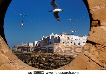 North bastion and ramparts of Essaouira Morocco viewed from Sqala du Port keyhole window View Large Photo Image Stock Image - North bastion and ramparts of Essaouira Morocco viewed from Sqala du Port keyhole window. Fotosearch