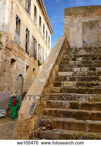 Old woman walking in the medina of the old Portuguese city of El Jadida Morocco View Large Photo Image Stock Image - Old woman walking in the medina of the old Portuguese city of El Jadida Morocco. Fotosearch