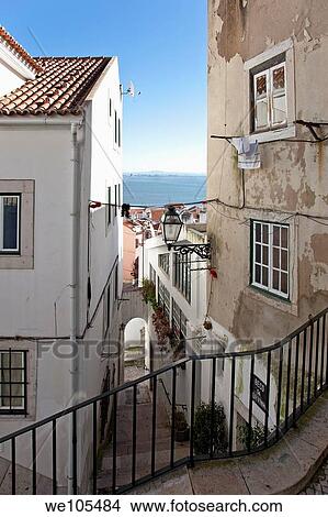 One of the narrow streets of Alfama with the typical cobblestone staircases Beco da Corvinha Alfama, Lisbon, Portugal View Large Photo Image Picture - One of the narrow streets of Alfama with the typical cobblestone staircases Beco da Corvinha Alfama, Lisbon, Portugal. Fotosearch