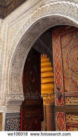 Open door of Mosque with intricate stone carving Zellige and paint in Fes Medina Morocco View Large Photo Image Stock Photo - Open door of Mosque with intricate stone carving Zellige and paint in Fes Medina Morocco. Fotosearch