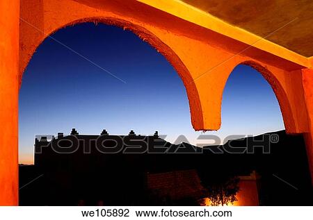 Orange adobe mud and straw resort arches with indigo sunset in Tinerhir Morocco View Large Photo Image Stock Image - Orange adobe mud and straw resort arches with indigo sunset in Tinerhir Morocco. Fotosearch