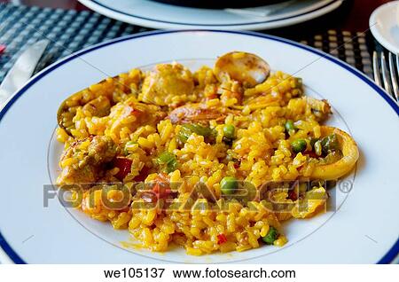 Paella serving View Large Photo Image Stock Photo - Paella serving. Fotosearch