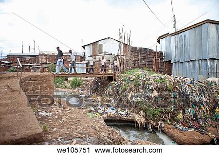 people crossing river of sewage, Kibera Kenya View Large Photo Image Stock Image - people crossing river of sewage, Kibera Kenya. Fotosearch