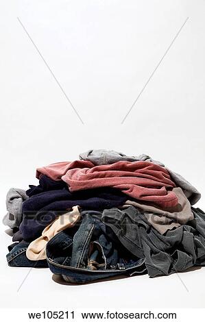 Stock Image - Pile of dirty clothes on a white background, Studio Composition, Laval, Quebec, Canada. Fotosearch