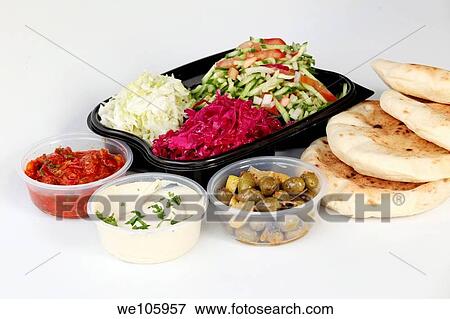 Pita and Middle Eastern salds in disposible plastic containers front row left to right Spicy Turkish salad, Tahini and olives View Large Photo Image Stock Photo - Pita and Middle Eastern salds in disposible plastic containers front row left to right Spicy Turkish salad, Tahini and olives. Fotosearch