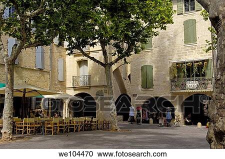 Stock Image - Place aux Herbes square, Uzes. Gard, Languedoc-Roussillon, France. Fotosearch