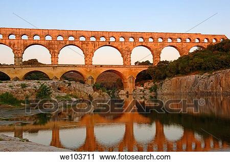Pont du Gard Roman aqueduct at dawn, Gard, Languedoc-Roussillon, France View Large Photo Image Stock Image - Pont du Gard Roman aqueduct at dawn, Gard, Languedoc-Roussillon, France. Fotosearch