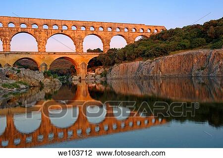 Pont du Gard Roman aqueduct at dawn, Gard, Languedoc-Roussillon, France View Large Photo Image Stock Image - Pont du Gard Roman aqueduct at dawn, Gard, Languedoc-Roussillon, France. Fotosearch