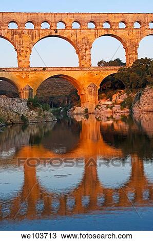Pont du Gard Roman aqueduct at dawn, Gard, Languedoc-Roussillon, France View Large Photo Image Stock Image - Pont du Gard Roman aqueduct at dawn, Gard, Languedoc-Roussillon, France. Fotosearch