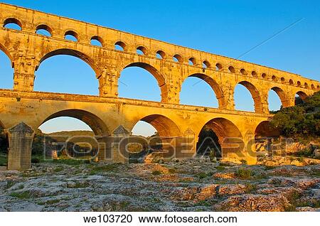 Pont du Gard Roman aqueduct at dawn, Gard, Languedoc-Roussillon, France View Large Photo Image Stock Image - Pont du Gard Roman aqueduct at dawn, Gard, Languedoc-Roussillon, France. Fotosearch
