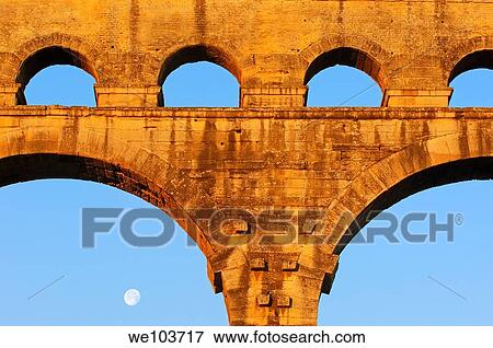 Pont du Gard Roman aqueduct at dawn, Gard, Languedoc-Roussillon, France View Large Photo Image Stock Photo - Pont du Gard Roman aqueduct at dawn, Gard, Languedoc-Roussillon, France. Fotosearch