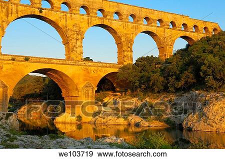 Stock Photo - Pont du Gard Roman aqueduct at dawn, Gard, Languedoc-Roussillon, France. Fotosearch