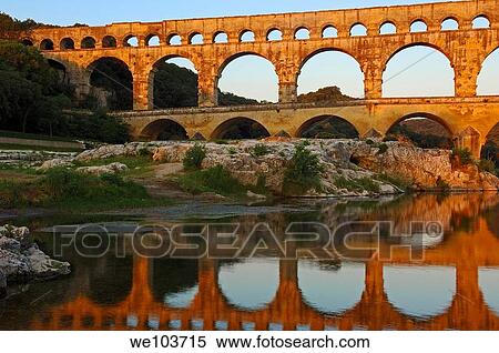 Stock Photography - Pont du Gard Roman aqueduct at dawn, Gard, Languedoc-Roussillon, France. Fotosearch