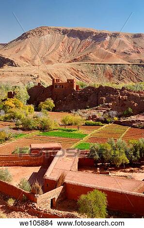 Red soil of Kasbah ruins and cultivated fields in Dades Gorge Morocco View Large Photo Image Picture - Red soil of Kasbah ruins and cultivated fields in Dades Gorge Morocco. Fotosearch