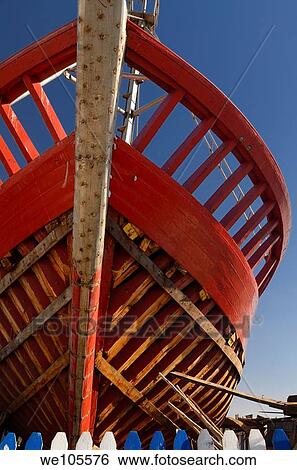 Red wooden boat under construction at the Essaouira Port in Morocco View Large Photo Image Stock Photograph - Red wooden boat under construction at the Essaouira Port in Morocco. Fotosearch