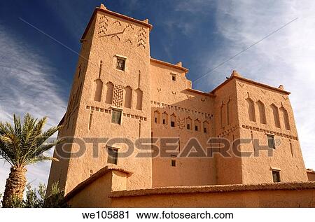 Stock Image - Refurbished historic Kasbah Ait Ben Moro with Palm and Olive tree at Skoura Morocco. Fotosearch