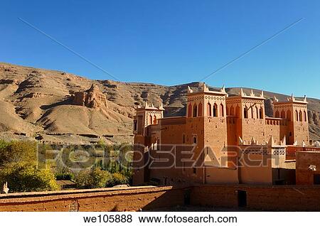 Stock Photo - Renovated Kasbah overlooking farm fields in the Dades Gorge valley Morocco. Fotosearch