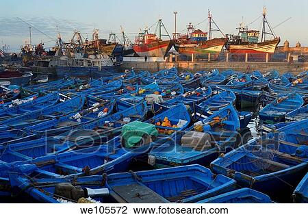 Sea of blue boats at sunrise in the marine port of Essaouira Morocco View Large Photo Image Stock Image - Sea of blue boats at sunrise in the marine port of Essaouira Morocco. Fotosearch