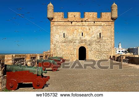 Sqala du Port fortress with cannons and seagulls in a blue sky at Essaouira Morocco View Large Photo Image Stock Image - Sqala du Port fortress with cannons and seagulls in a blue sky at Essaouira Morocco. Fotosearch