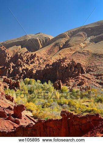 Tamnalt Kasbahs with red rock and limestone fingers in Dades Gorge Morocco View Large Photo Image Stock Photography - Tamnalt Kasbahs with red rock and limestone fingers in Dades Gorge Morocco. Fotosearch