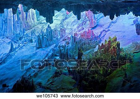 The beautifully illuminated Reed Flute Caves displaying the ´Crystal Palace of the Dragon King´ formations Located in Guilin, Guangxi Provine, China View Large Photo Image Stock Image - The beautifully illuminated Reed Flute Caves displaying the ´Crystal Palace of the Dragon King´ formations Located in Guilin, Guangxi Provine, China. Fotosearch