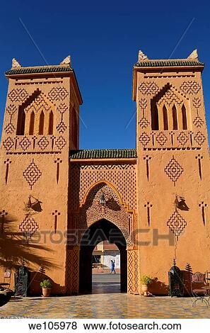 Traditional Berber pise towers made of red adobe and blue sky at desert resort View Large Photo Image Stock Photo - Traditional Berber pise towers made of red adobe and blue sky at desert resort. Fotosearch