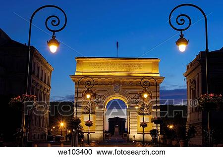 Stock Image - Triumphal Arch at dusk, Montpellier, Herault, Languedoc-Roussillon, France. Fotosearch