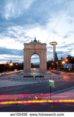 Stock Photograph - Triumphal Arch in the evening. Madrid, Spain.. Fotosearch