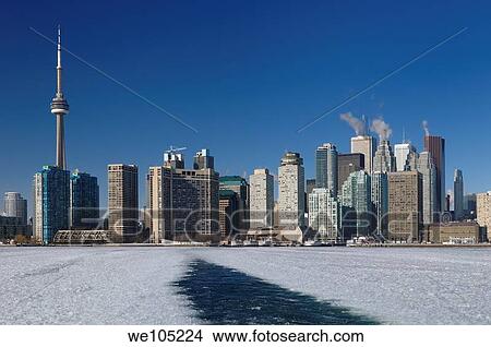 Wake of a winter ferry to the Toronto Islands with city skyline and ice slush View Large Photo Image Picture - Wake of a winter ferry to the Toronto Islands with city skyline and ice slush. Fotosearch