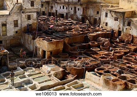 White mineral soaking vats and brown vegetable tanning pits in the Fes tannery Morocco View Large Photo Image Stock Image - White mineral soaking vats and brown vegetable tanning pits in the Fes tannery Morocco. Fotosearch