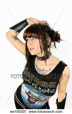 Young heavy metal lady with horns piercings and tattoos on a white background View Large Photo Image Stock Image - Young heavy metal lady with horns piercings and tattoos on a white background. Fotosearch