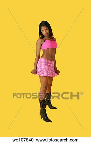 Stock Image - African American woman in early 20´s doing glamour modeling. Fotosearch