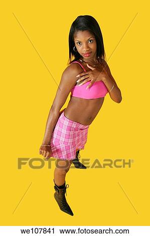Stock Image - African American woman in early 20´s doing glamour modeling. Fotosearch