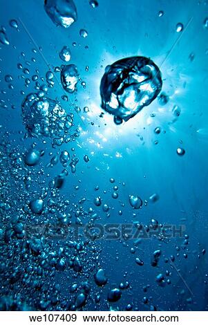 Air bubbles underwater illuminated by sunbeams, Marseille, France View Large Photo Image Stock Photo - Air bubbles underwater illuminated by sunbeams, Marseille, France. Fotosearch