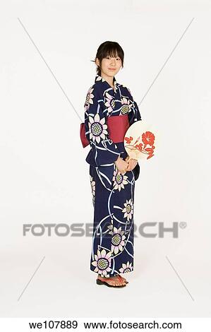 Stock Photo - Asian teen dressed in a Kimono an a white background. Fotosearch