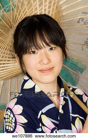 Asian teen dressed in a Kimono View Large Photo Image Stock Photograph - Asian teen dressed in a Kimono. Fotosearch