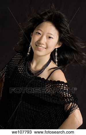 Asian teen posing in a studio View Large Photo Image Stock Image - Asian teen posing in a studio. Fotosearch