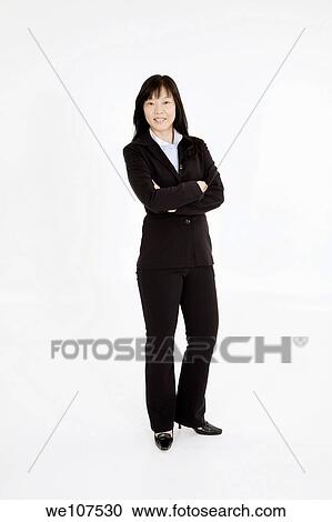 Beautiful Asain Businesswoman posing on a white background View Large Photo Image Stock Image - Beautiful Asain Businesswoman posing on a white background. Fotosearch